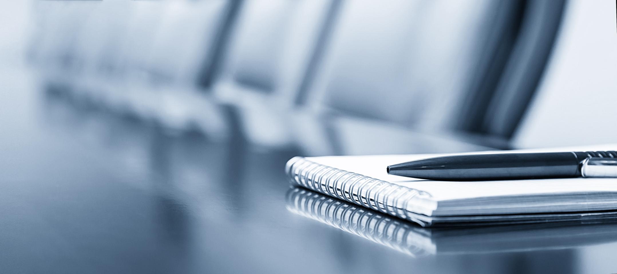 TOK Business Brokerage Services Image of table notepad and pen